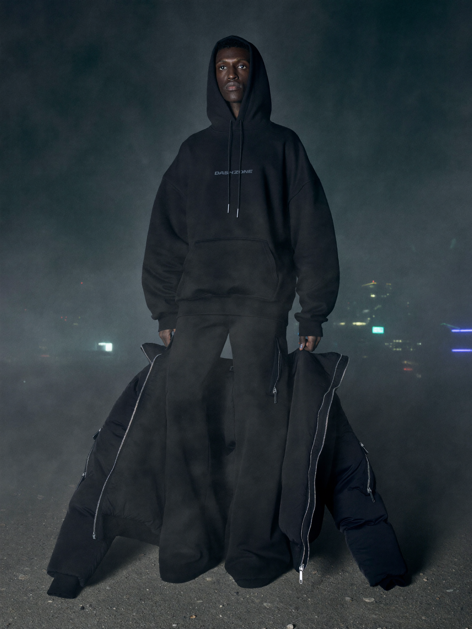 Model wearing the full DASH ZONE Midnight Drop fit on a foggy rooftop